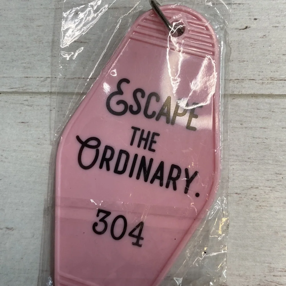Medusa’s Makeup Light Pink “Escape the Ordinary” Hotel Room Key Chain